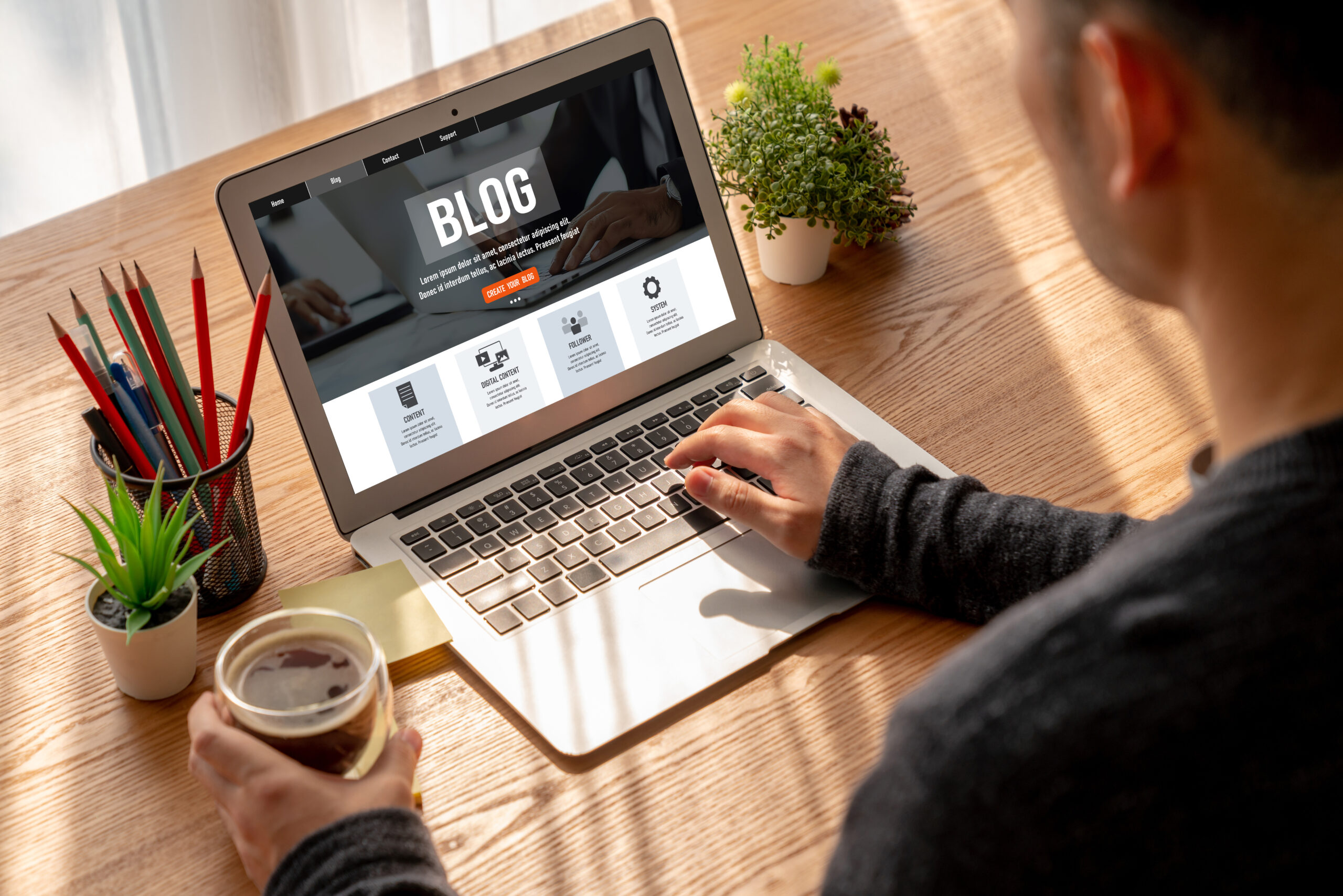 Exploring AI Insights Blog on Laptop Person browsing AI blog articles on a laptop with coffee on desk.